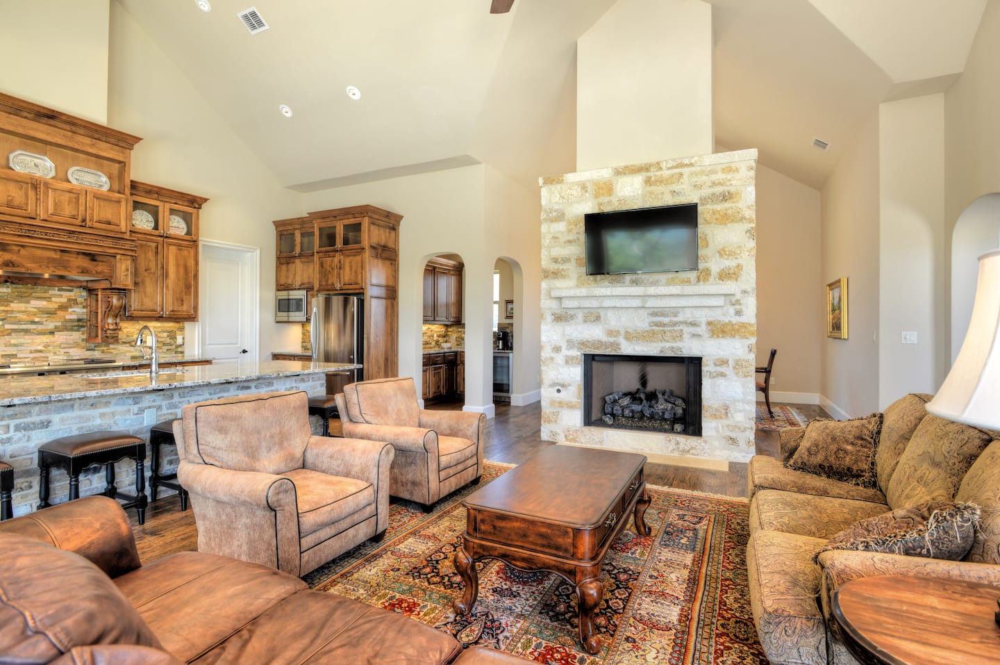 Open living area with limestone fireplace