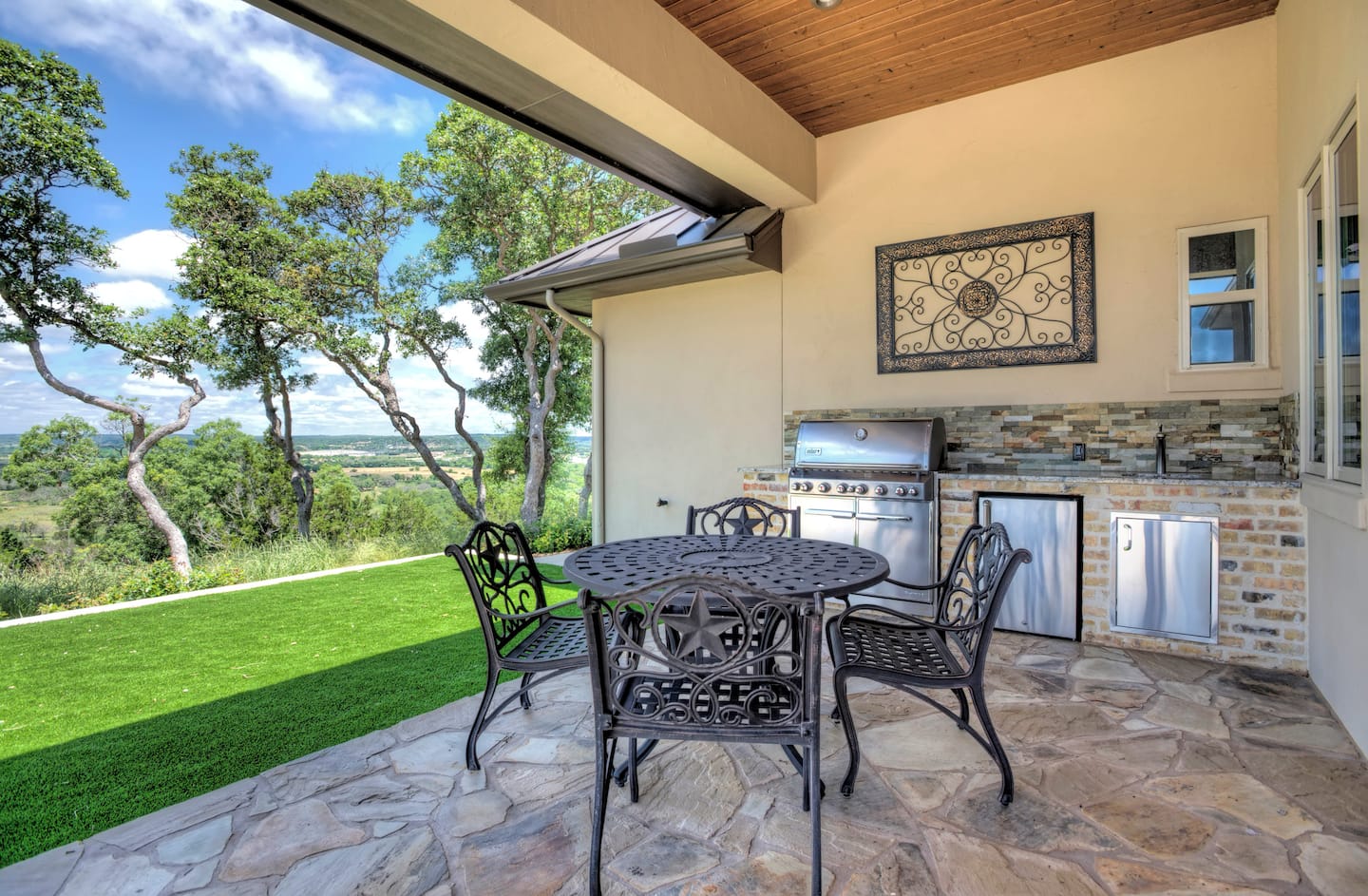 Covered outdoor kitchen beside the pool