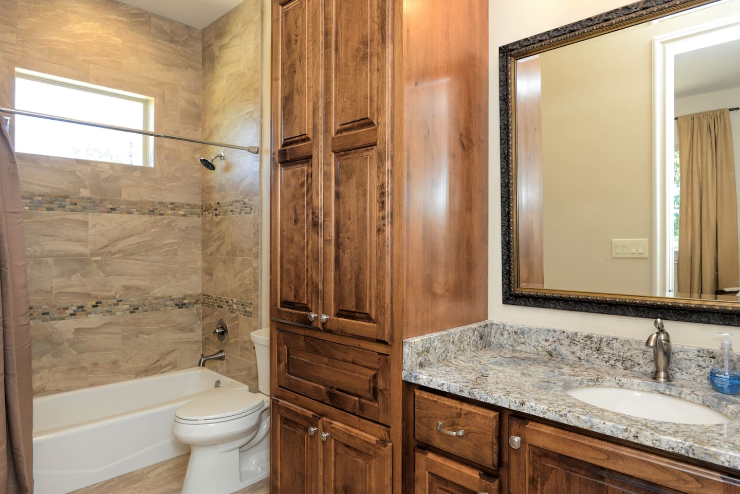 Second en-suite bathroom with a vanity and shower
