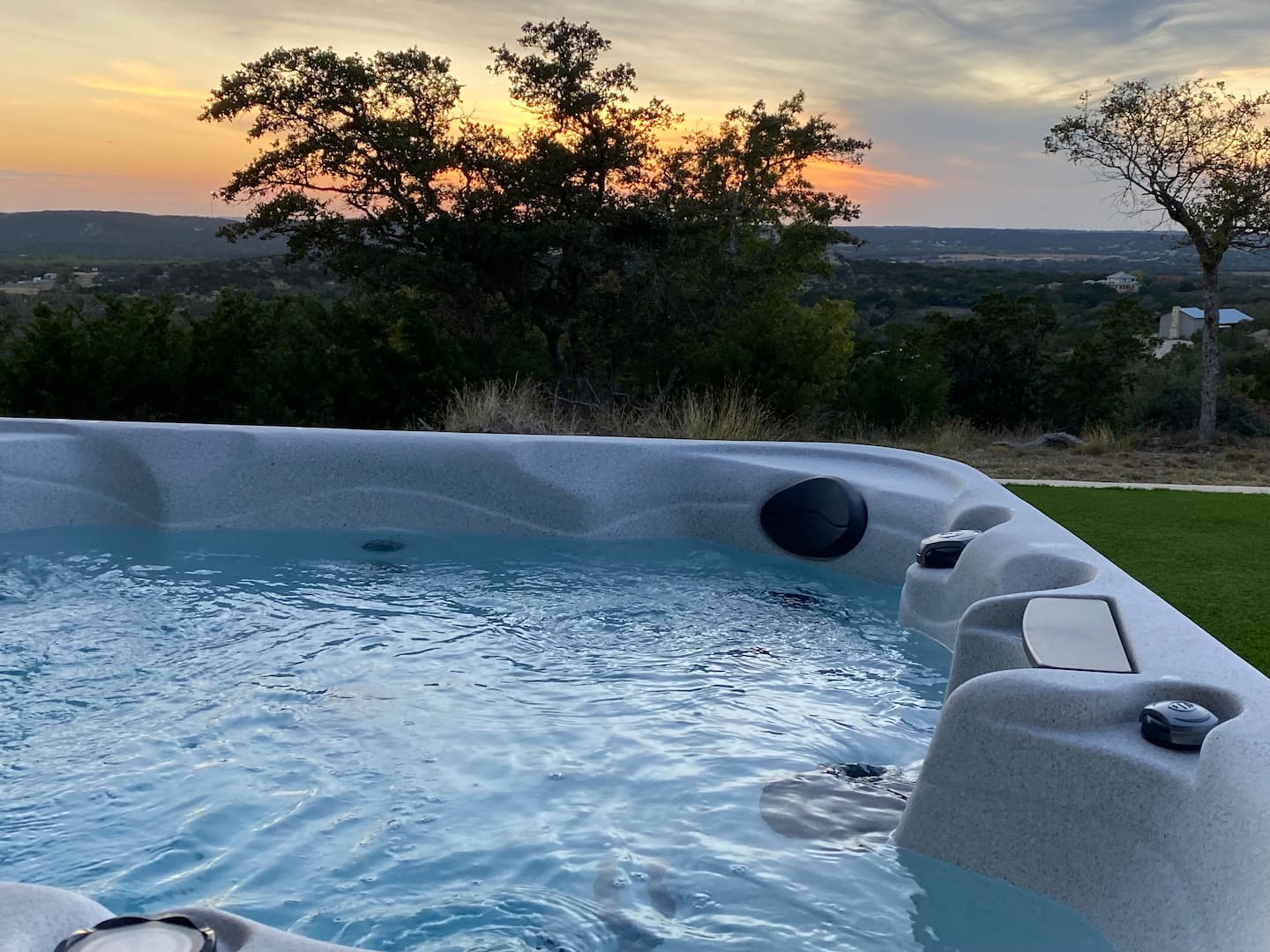 Bubbling hot tub and Hill Country sky at sunset